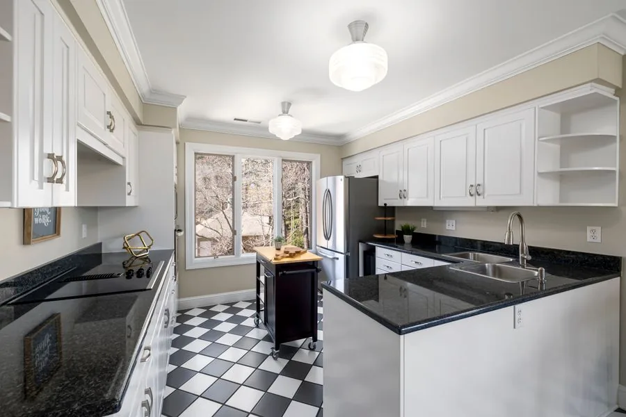 Kitchen with a tiled floor in a slab home
